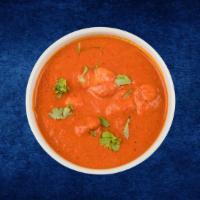Smoky Chicken Tikka · Char grilled chicken morsels slow cooked in a rich onion and tomato gravy with generous amou...