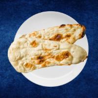 Butter Naan · House made hand pulled and leavened dough baked to perfection in an Indian clay oven and bas...