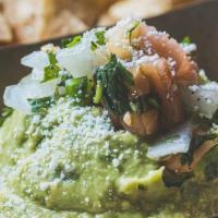 Guacamole · Creamy Avocadoes, Fresh Lime, Garlic, Cilantro, and Jalapenos. Topped with Cotija cheese. Se...