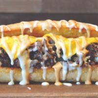 The Classic Philly  · Seasoned steak topped with onions, American cheese, white cheese sauce and chipotle aioli. S...