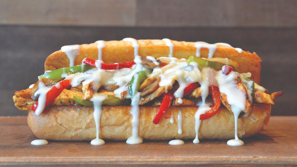Original Chicken Philly · Seasoned chicken breast topped with onions, red and green peppers, mushrooms, Provolone cheese and white cheese sauce. Served on a traditional hoagie roll.