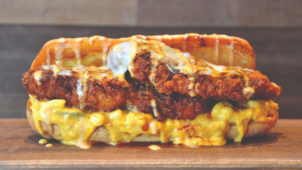 Nashville Mac Philly · Hand breaded chicken tenders topped with provolone cheese, Nashville hot mac & cheese (prepared with bacon and roasted green chilies) and lucky aioli sauce. Served on a traditional hoagie roll. *mac & cheese cannot be modified.