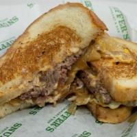 Patty Melt · 2 1/4 pound pattys topped with melted cheddar and swiss cheese with caramelized onions and 1...