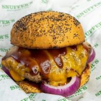 Hickory Bbq Burger · 1/2 Pound patty with cheddar cheese, hickory bbq sauce and red onions. Served on a poppy see...