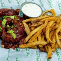 Nashville Hot Chicken Strips · Signature hand-breaded tenders tossed with hot Nashville sauce, served with fries