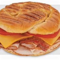 Turkey, Bacon & Cheddar · Oven-roasted turkey, crisp bacon, smoked cheddar and tomatoes with spicy mustard