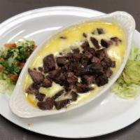 Queso Fajita · Melted monterrey jack cheese topped with fajita. Comes with a side of tortillas, Pico de gal...