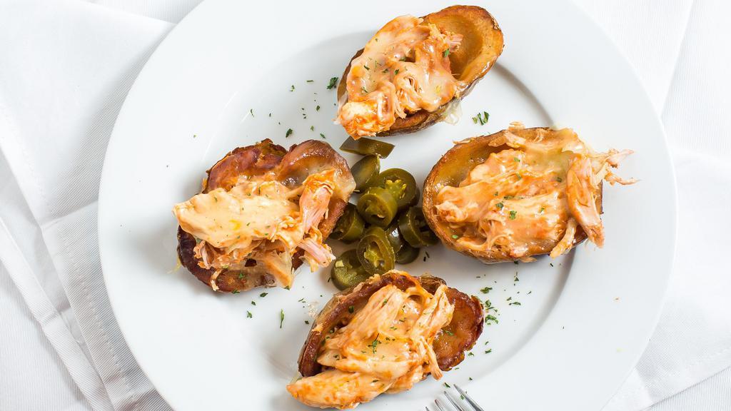 Potato Skins · Four deep fried potato skins served with melted cheddar, white cheese, sour cream, guacamole and jalapenos.