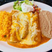 Chicken Enchiladas (3) · Three shredded chicken enchiladas topped with melted cheddar cheese and chili meat gravy sau...