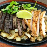 Combination Fajitas  · Served with rice, your choice of refried, charros or black beans, grilled onions, pico de ga...
