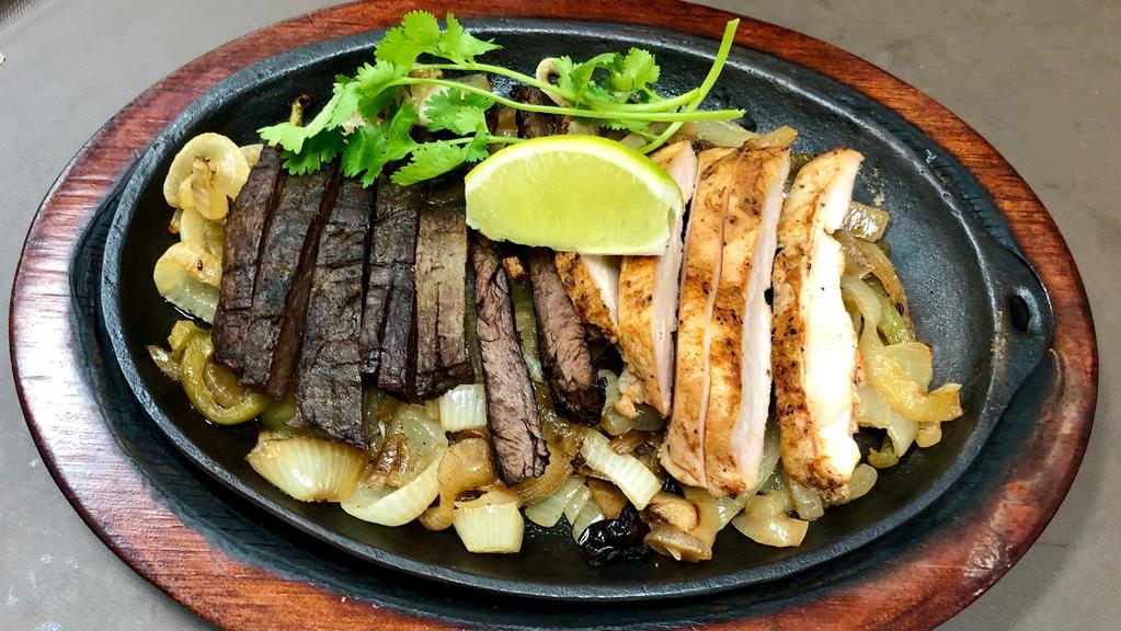 Combination Fajitas  · Served with rice, your choice of refried, charros or black beans, grilled onions, pico de gallo, guacamole and handmade flour tortillas.