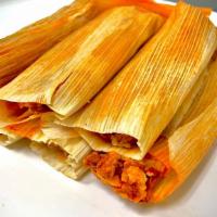 1 Dz Pork Tamales In Red Sauce - Mild Spicy · Available daily until 2 PM  - One dozen tamales, corn based Mexican masa filled with pork co...