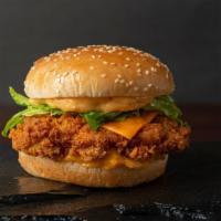 Cheesy Regular Chicken Sandwich · Delicious sandwich made with Fried chicken, melted cheese, lettuce, pickles, tomatoes, and m...