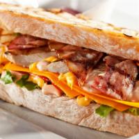 Bacon Chicken Sandwich · Delicious sandwich made with Fried chicken, crispy bacon, lettuce, pickles, tomatoes, srirac...