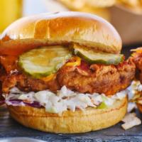 Cheesy Spicy Chicken Sandwich · Delicious sandwich made with Fried chicken, melted cheese, lettuce, pickles, tomatoes, srira...