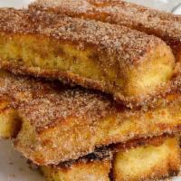 French Toast Sticks Meal (4 Pieces) · Four French toast stix with syrup and a kids' drink.