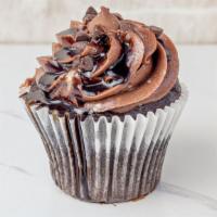 Chocolate  Truffle · A dreamy, dark chocolate cupcake with a fudge ganache, and chocolate cloud frosting, topped ...