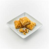 Classic Pistachio Baklava · Per Piece: Golden, crispy sheets of filo dough stuffed with a pistachio mixture