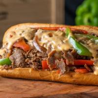 Cheese Steak Sandwich · shaved sirloin, sauteed peppers and onions,. homemade cheese “wiz,” toasted hoagie