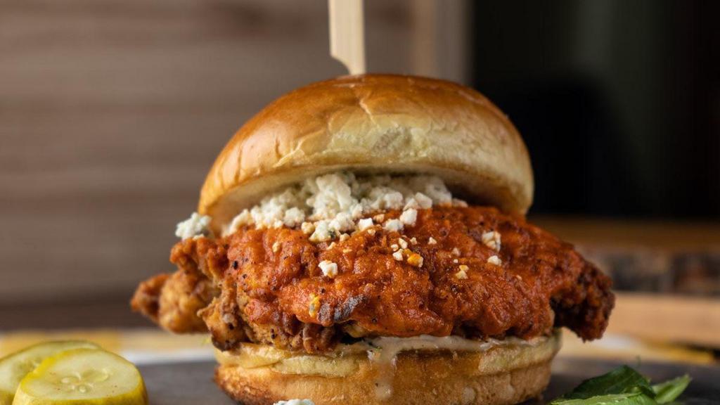 Buffalo Chicken Sandwich · hand-breaded fried chicken breast, classic buffalo sauce, blue cheese crumbles, house ranch, shaved celery, toasted bun