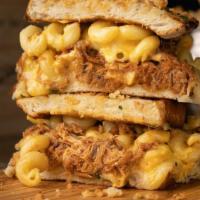 Bbq Pulled Pork 'Mac & Grilled Cheese' Sandwich · pulled pork, bbq sauce, creamy mac & cheese, toasted parmesan crusted sourdough, herb cheese...