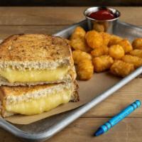 Grilled Cheese & Tots · four slices of white cheddar between warm and toasty bread served with tots