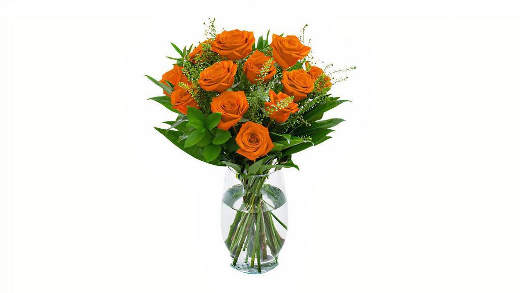 Unforgettable Arrangement (Orange) · A Dozen Orange Roses with greenery and filler in a clear vase.