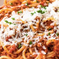 Spaghetti A La Bolognese · Spaghetti with seasoned tomato base sauce and beef.