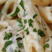 Chicken Penne Alfredo · Penne with creamy Alfredo sauce and grilled chicken.