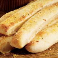 Bread Sticks (8 Pcs.) · Fresh-baked bread strips with garlic butter topped with Parmesan and Roma seasoning. Served ...