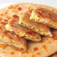 Aloo Paratha · A layered flat bread made with flour, salt, water and ghee (Oil) and then stuffed with delic...