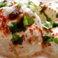 Dahi Vada · Lentil dumplings topped with sweet yogurt, chaat masala, tamarind and green chutney.