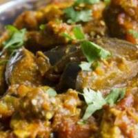 Baingan Sabzi · Indian eggplant cooked with onions, tomatoes, ginger garlic paste and our special blend of s...