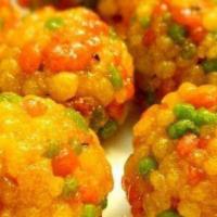 Boondi Ladoo (1 Pc) · Boondi ladoos are made with gram flour (besan) that is poured through a ladle to form small ...