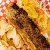Creole Sausage Po' Boy · Dressed: lettuce, tomato, pickle and house remoulade. Served with chips