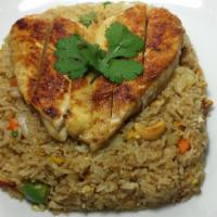 Kai Yang · Thai marinated grilled chicken breast. Served over Thai pineapple fried rice with pea, carro...