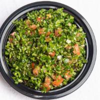 Tabbouleh · Vegan. A traditional Lebanese salad containing parsley, tomatoes, mint, spring onion, crushe...