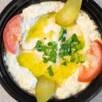 Baba Ghanoush · Vegan. A traditional appetizer mashed cooked eggplant mixed with tahini, olive oil, lemon ju...