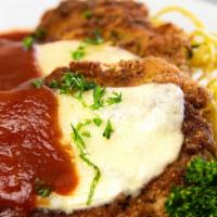 Chicken Parmesan  · 2  tender pan fried chicken breast,  baked with cheese and served with our house made Napoli...