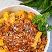 Rigatoni Bolognese · Rigatoni pasta tossed with our homemade  creamy Bolognese Sauce (made it with a mixed of bee...