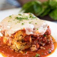 Lasagna · Layers of pasta  with Bechamel Sauce, Meat Ragu Sauce (made with beef, pork, spices), baked ...