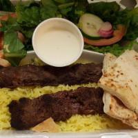 Beef Shish Kebab · Kafta. Skewered ground beef, grilled. Served with rice, Mediterranean salad, garlic sauce, a...