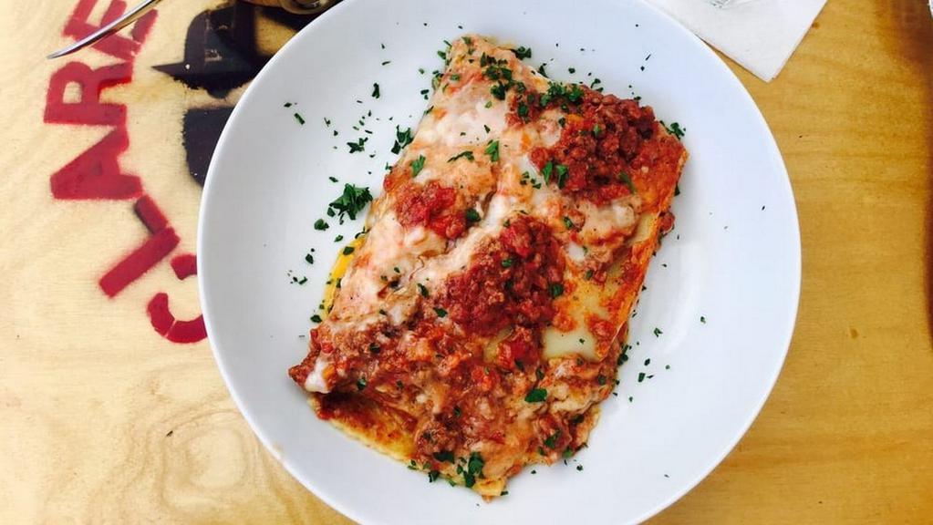 Grandma’S Lasagna · With beef, onions, Ricotta, Mozzarella, and tomato sauce.