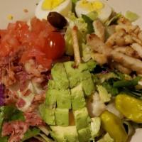 Cobb Salad · Chopped salad with fresh tomatoes, bacon, boiled egg, avocado, grilled chicken, and cheese w...
