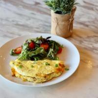 Up Omelet · Three pasture raised eggs, bacon, onions, red bell peppers, cheddar cheese. Served with Mixe...
