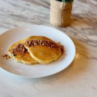 Blueberry Almond · Almond flour pancakes, blueberries, topped with coconut sugar-pecan crumble and served with ...