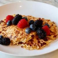 Oat & Grain Protein · Whole grain & oat pancakes, cottage cheese, topped with fresh berries and served with pure m...