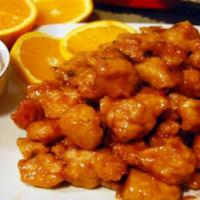 Orange Chicken/陈皮鸡 · Deep-fried crispy white meat chicken chunks sautéed with orange peels and red chili pepper i...