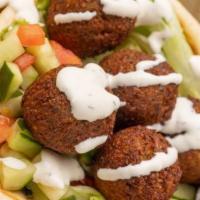Gyro & Falafel Wrap · Gyro and fried veggie balls with lettuce, tomato, cucumbers, and our white sauce and hot sau...