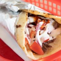 Kofta Kebab Wrap · Marinated mixture of ground beef and veggies charbroiled on a skewer and wrapped in pita bre...